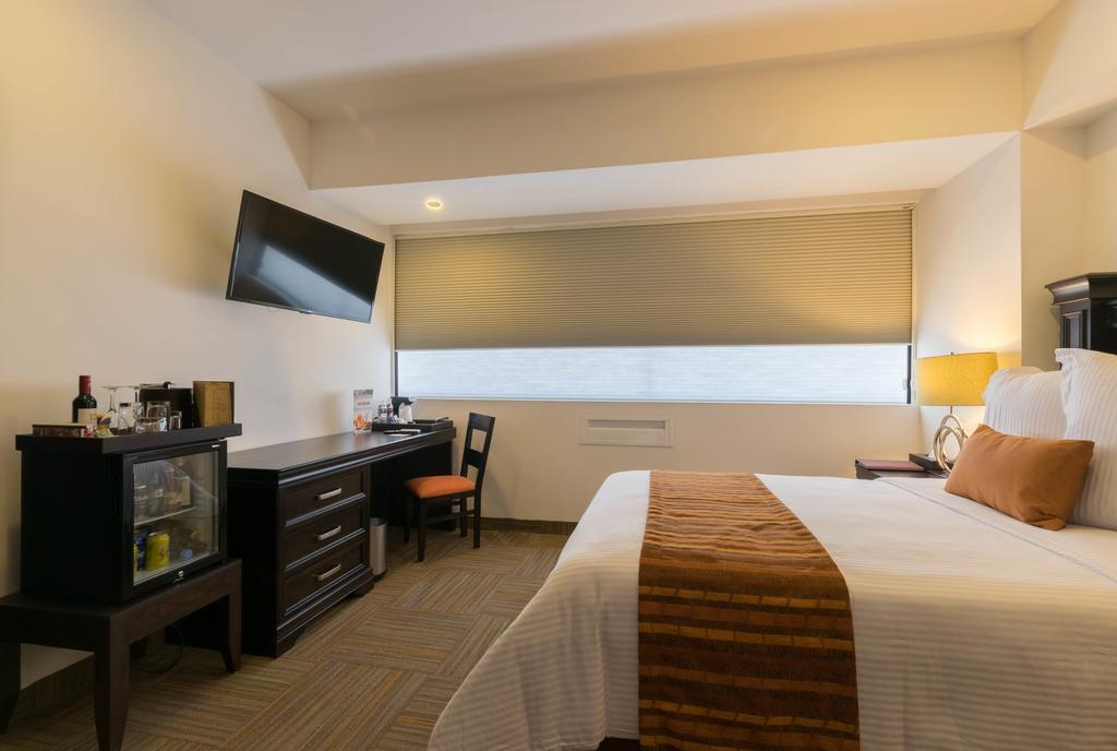 Hotel Stadium León Exterior foto A room at the hotel